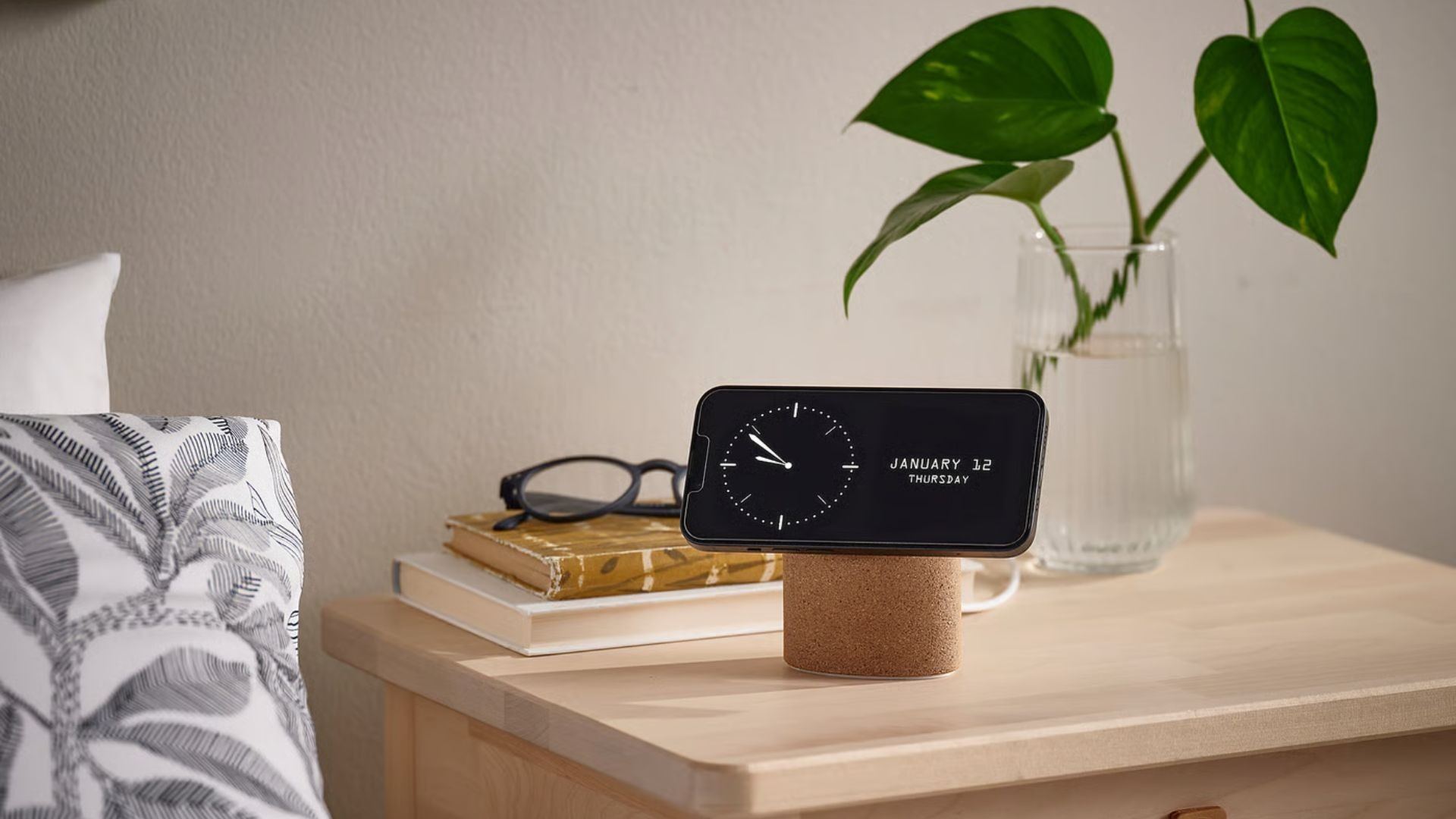 The IKEA wireless charging stand holding a phone horizontally as a bedside clock. Source product image: IKEA / Future.