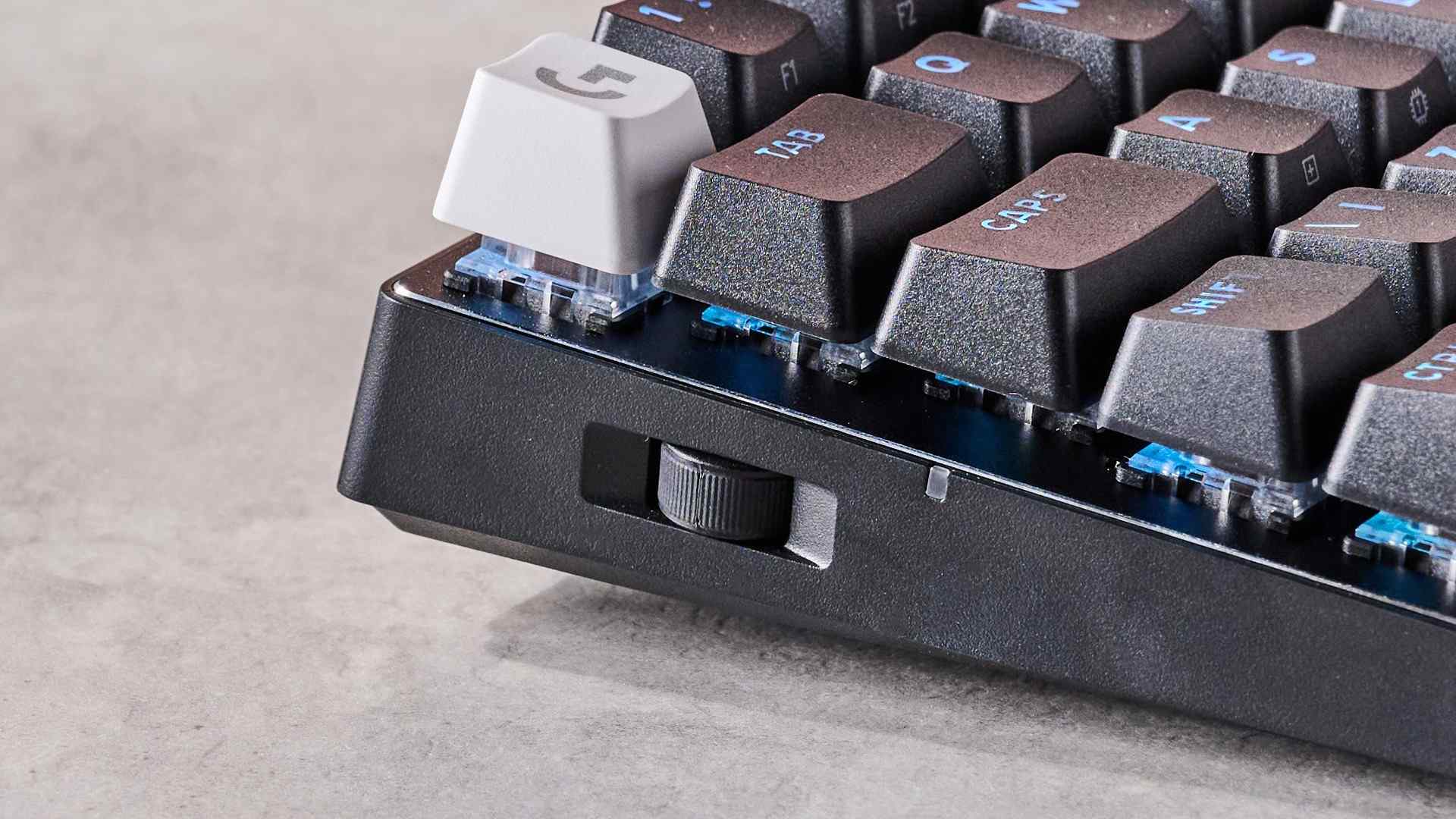 The Logitech Pro X 60 left-side volume wheel below the Escape-key area. Image: Lewis Maddison / Future.