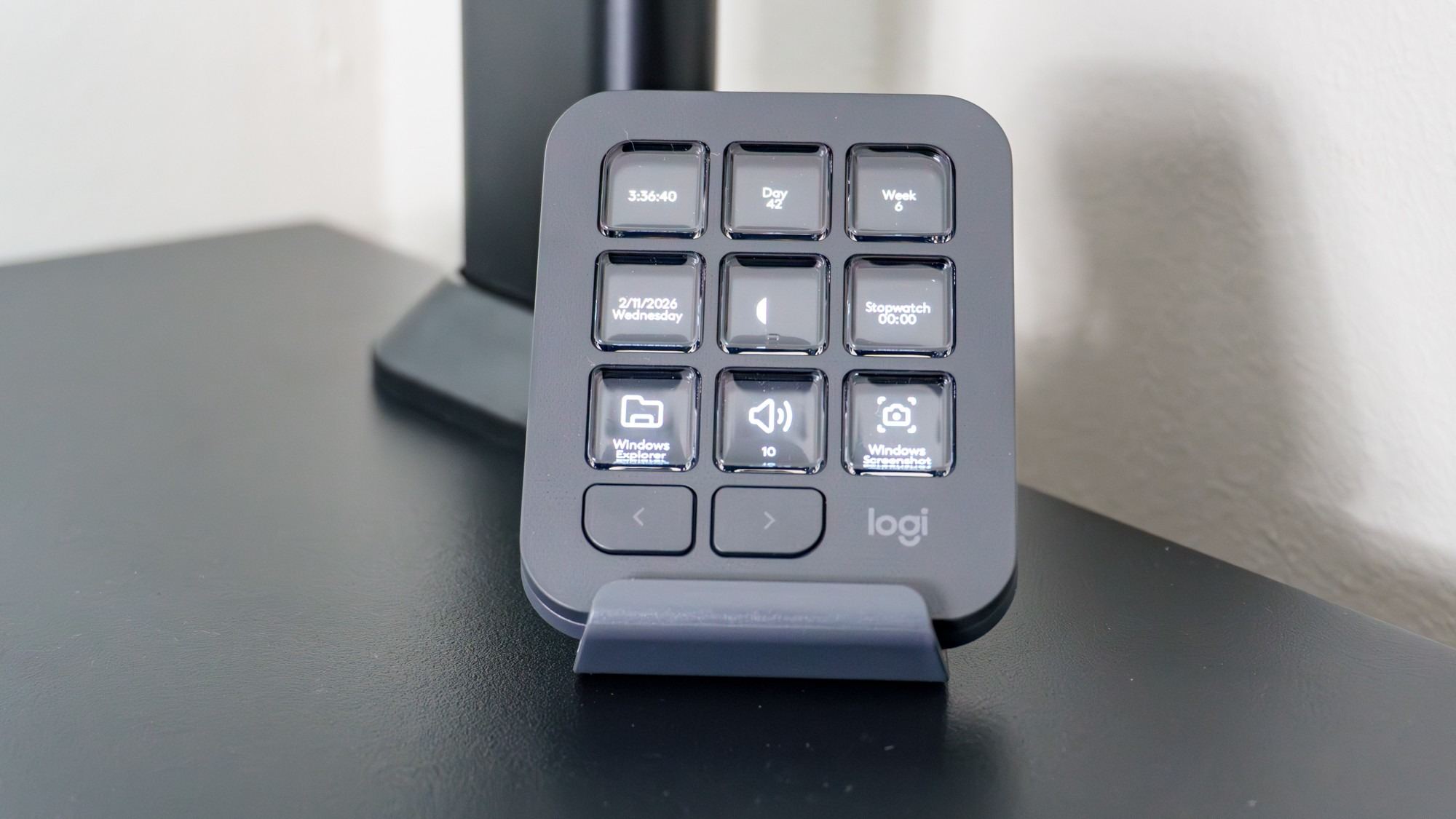 The MX Creative Keypad displaying information on its nine keys in the reviewer's setup. Image: Anthony Spadafora / Future.