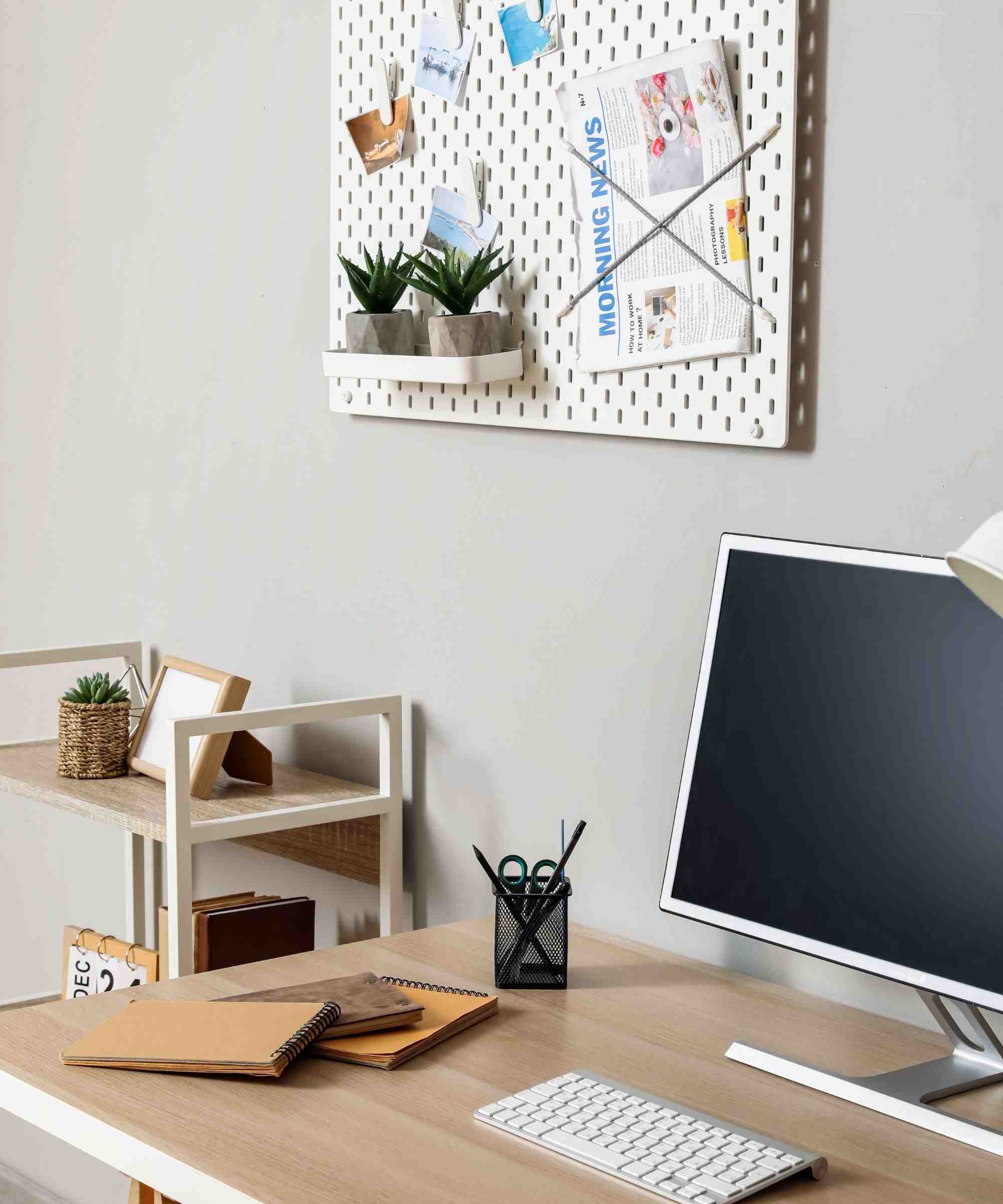 A pegboard and compact desktop in one of the source's organization examples. Image: Homes and Gardens.