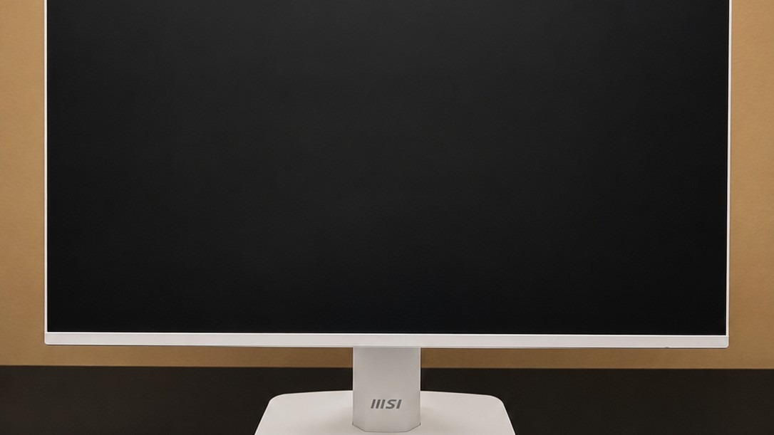 The MSI MP243W E14 front bezel and supplied stand with the base phone slot visible. Image: Collin Probst / Future.