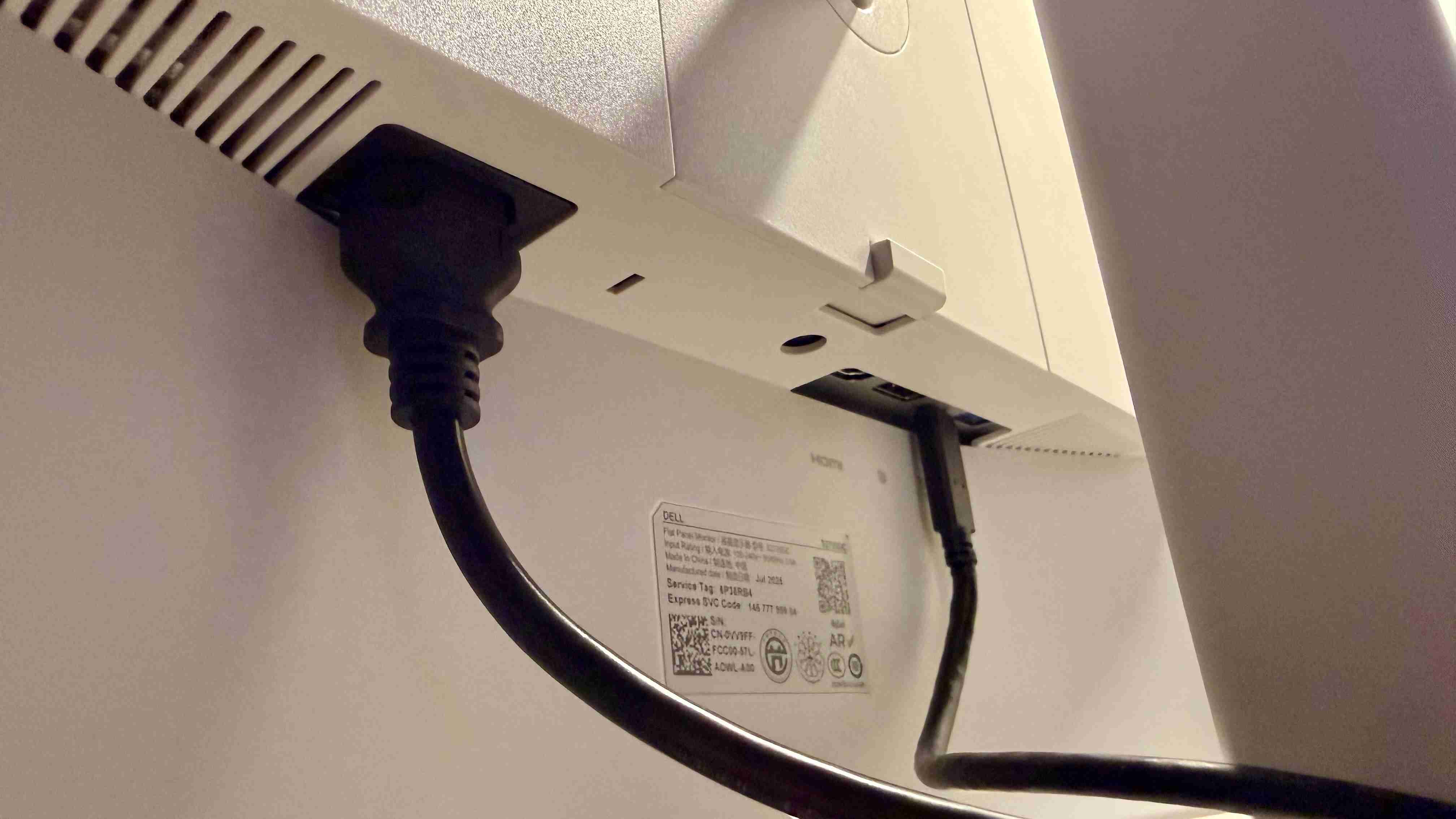 A close view of the Dell S2725DC rear connections with power and signal leads attached. Image: Collin Probst / Future.