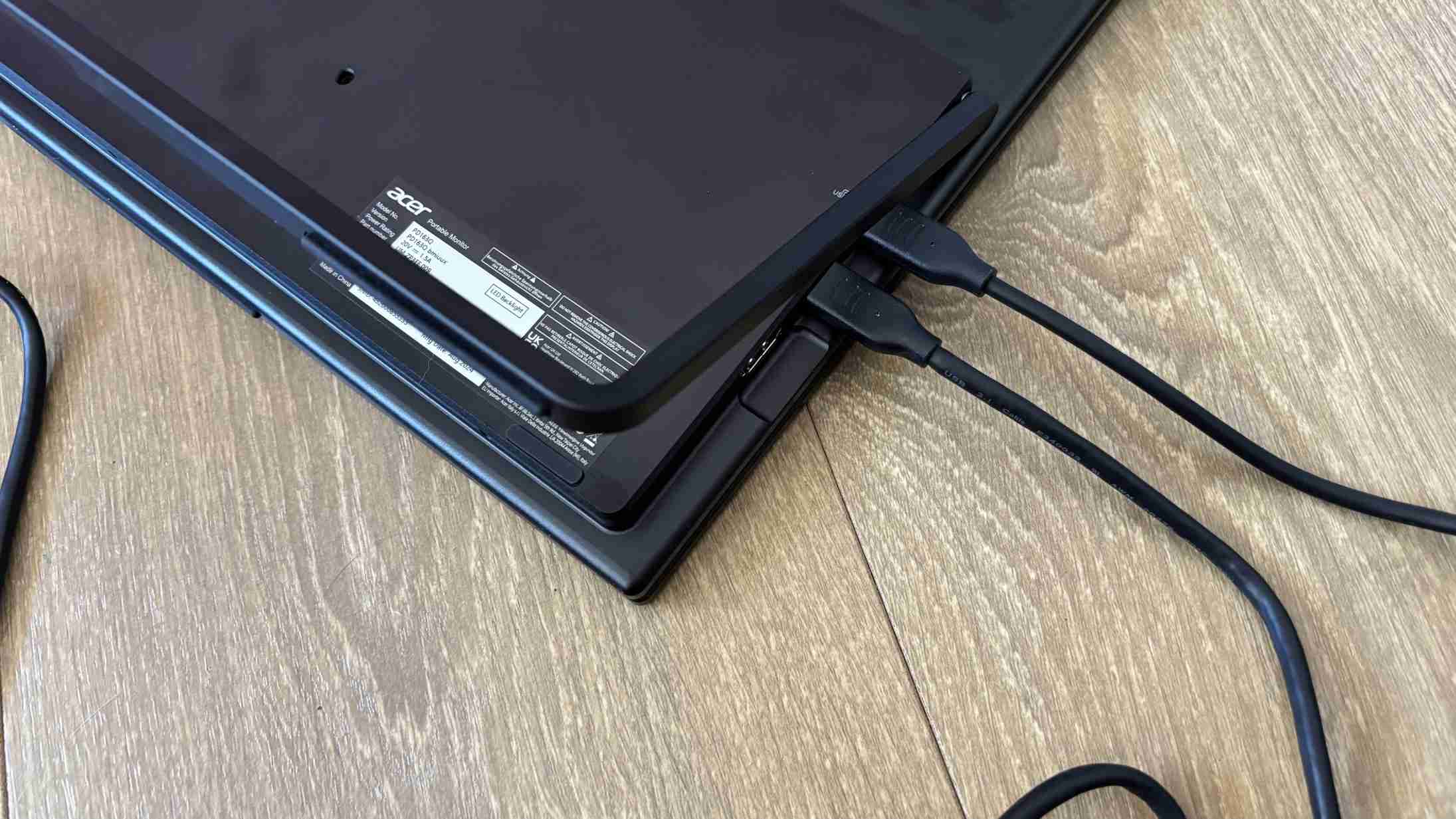 A close view of the Acer PD3 connections and attached leads beneath its opened support. Image: Jasmine Mannan / Future.