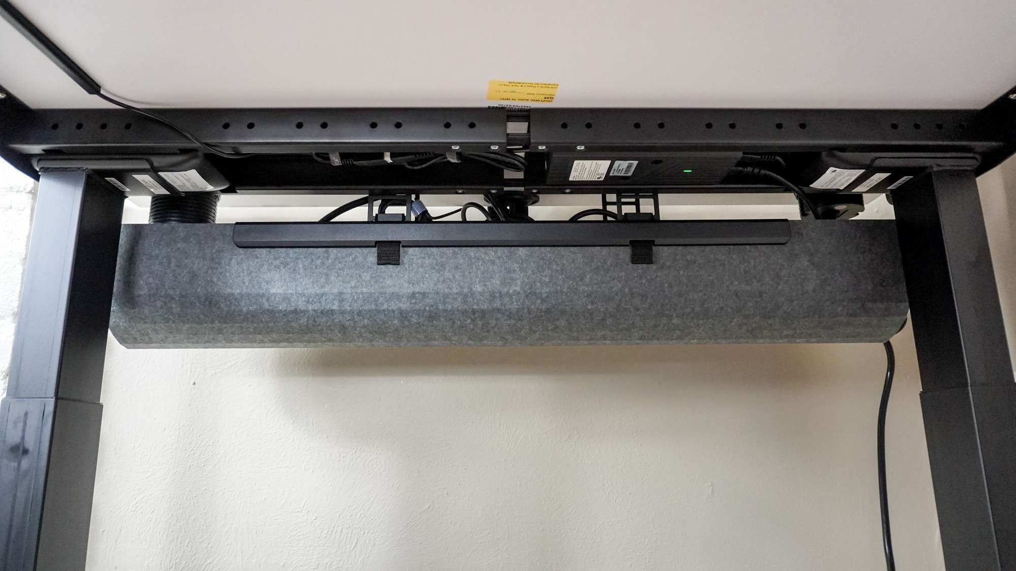 The Uplift V3 cable-management tray seen beneath the desktop. Image: Anthony Spadafora / Future.