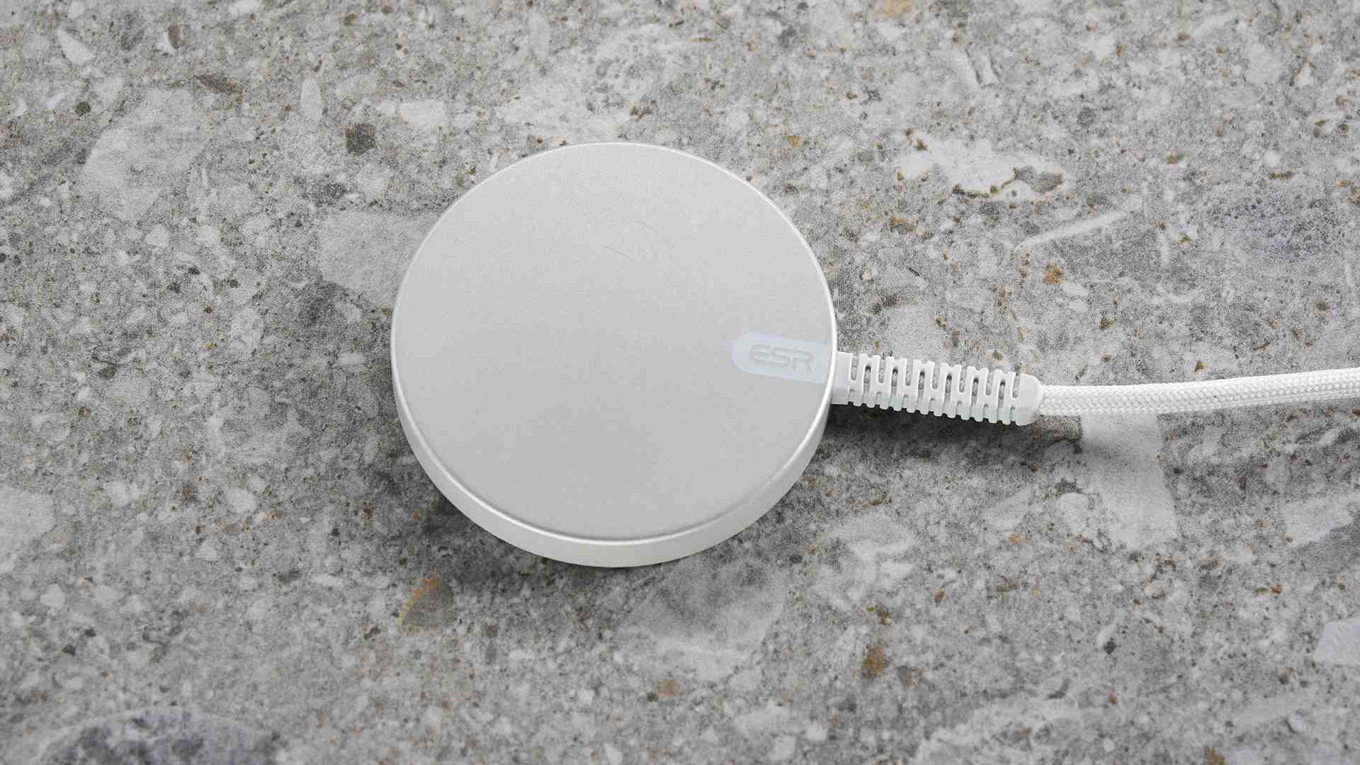 The back of the ESR Qi2 Mini charging pad, showing its attached lead and reinforced cable sleeve. Image: Future.