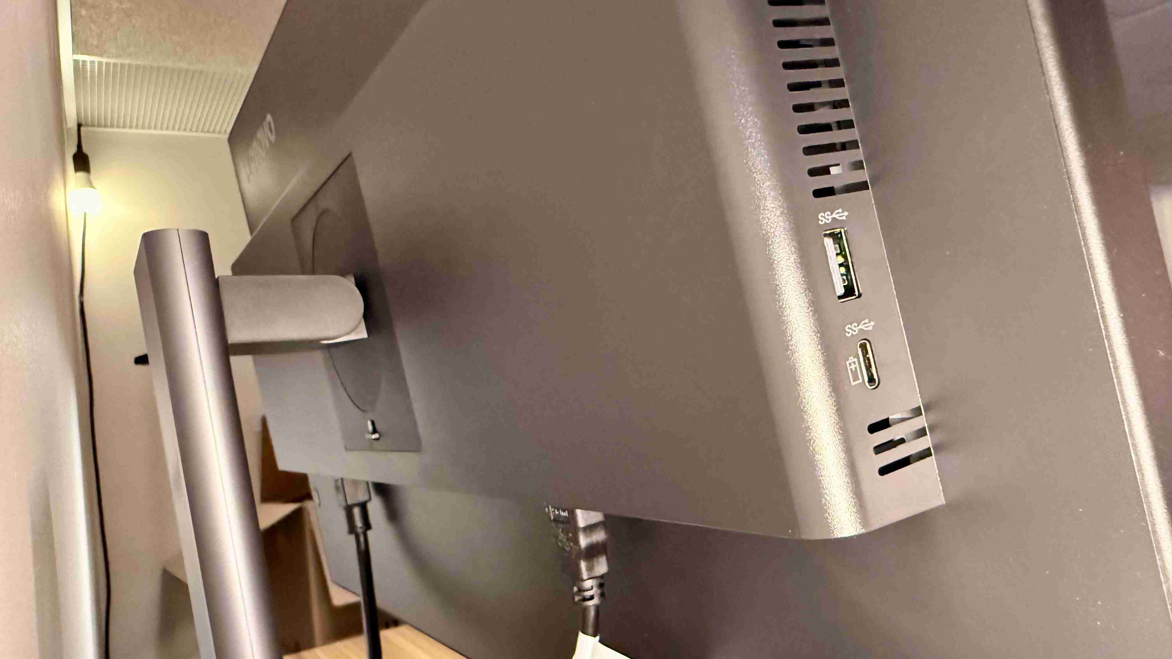 The ThinkVision side USB-A and USB-C connections beside the rear support. Image: Collin Probst / Future.