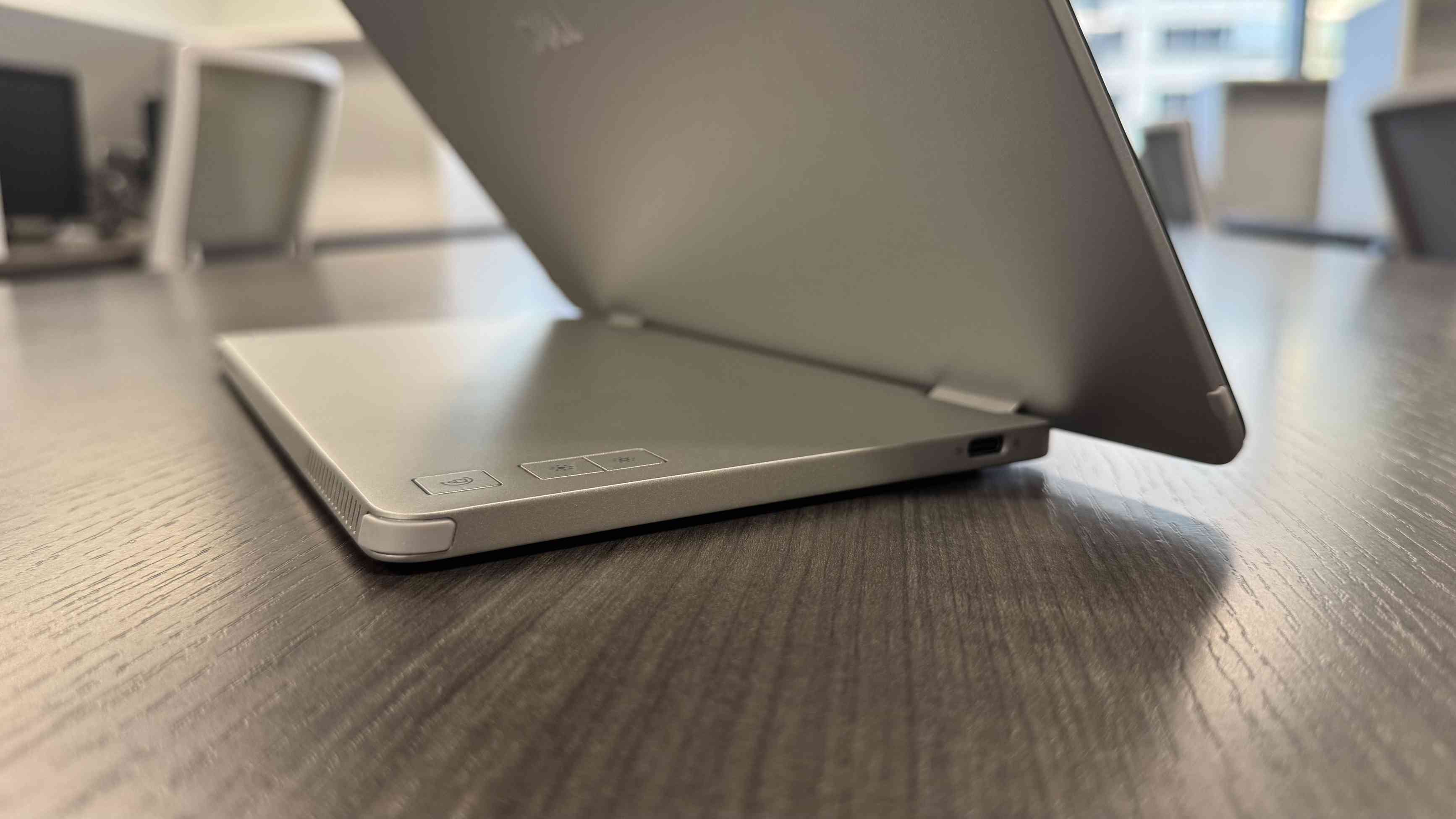 A side-rear view of the Dell Pro 14 Plus with its folding support open and a USB-C socket visible. Image: Collin Probst / Future.